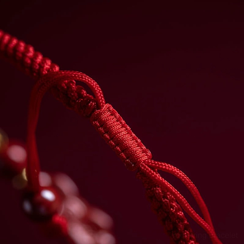 Cinnabar red string bracelet featuring PiXiu charm for wealth and fortune