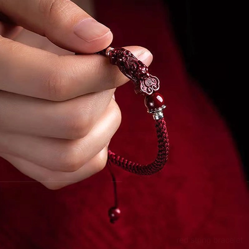 Cinnabar Pixiu lucky charm bracelet with handwoven red rope detail