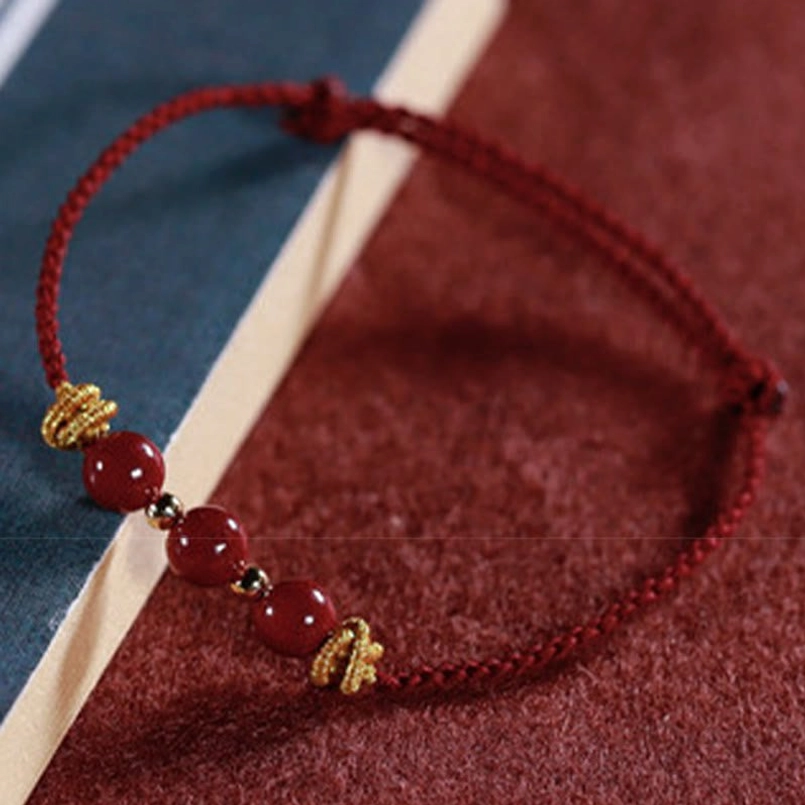 Tibetan cinnabar bracelet lifestyle shot worn on female wrist