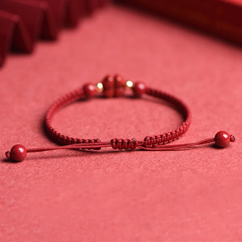 Adjustable cinnabar red string bracelet with multiple beads and pull-tie design
