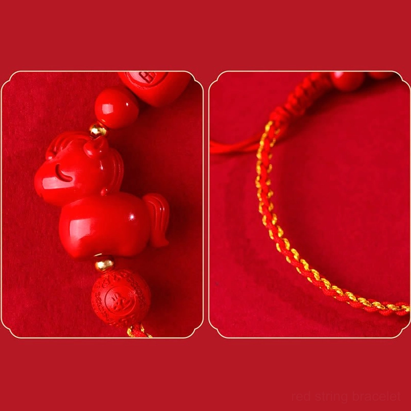 Detail close up of cinnabar beads horse pendant and golden trim red rope