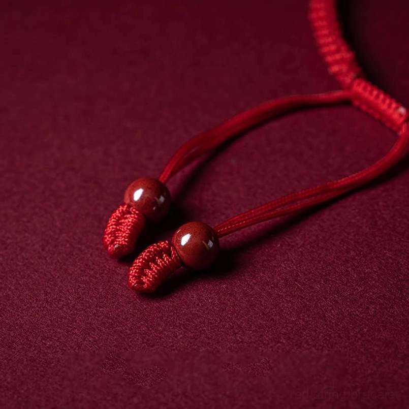 Handmade cinnabar red string bracelet with intricate braided weave detail