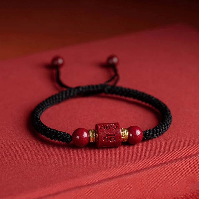 Tibetan blessing bracelet with om mani padme hum carved bead and gold metalwork