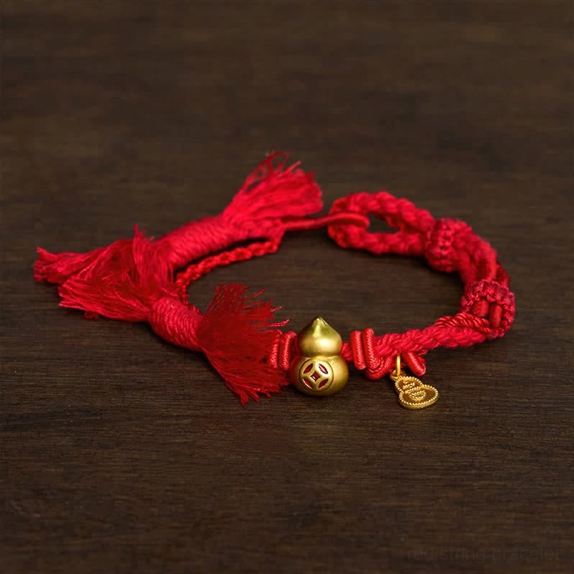 Classic red rope red string bracelet with gold gourd charm three quarter view