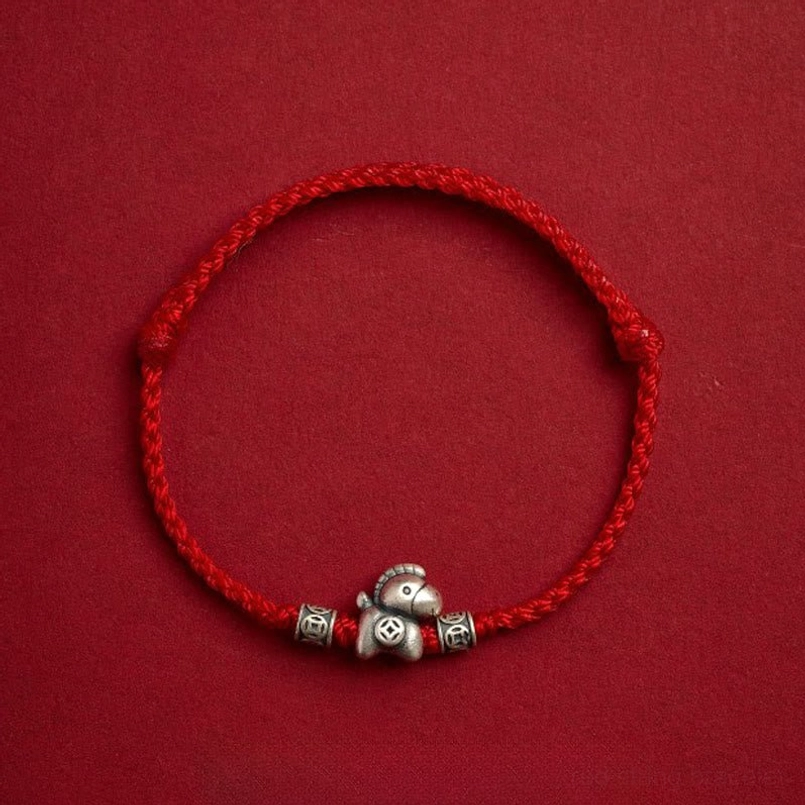 Single classic red braided year of horse protection bracelet with silver horse charm
