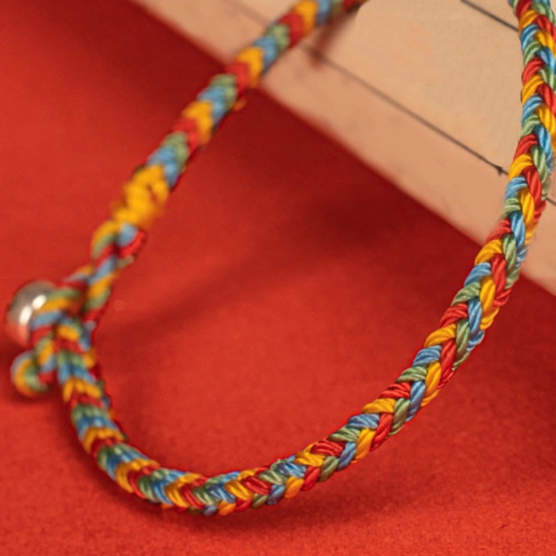 Close Up Low Oblique View Multicolor Woven Red String Bracelet