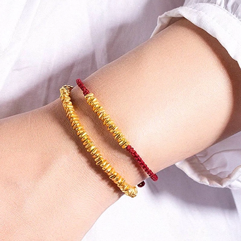 999 gold red string bracelet with clustered gold beads flat lay