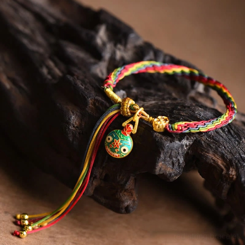 Colorful braided string bracelet with golden hardware detail