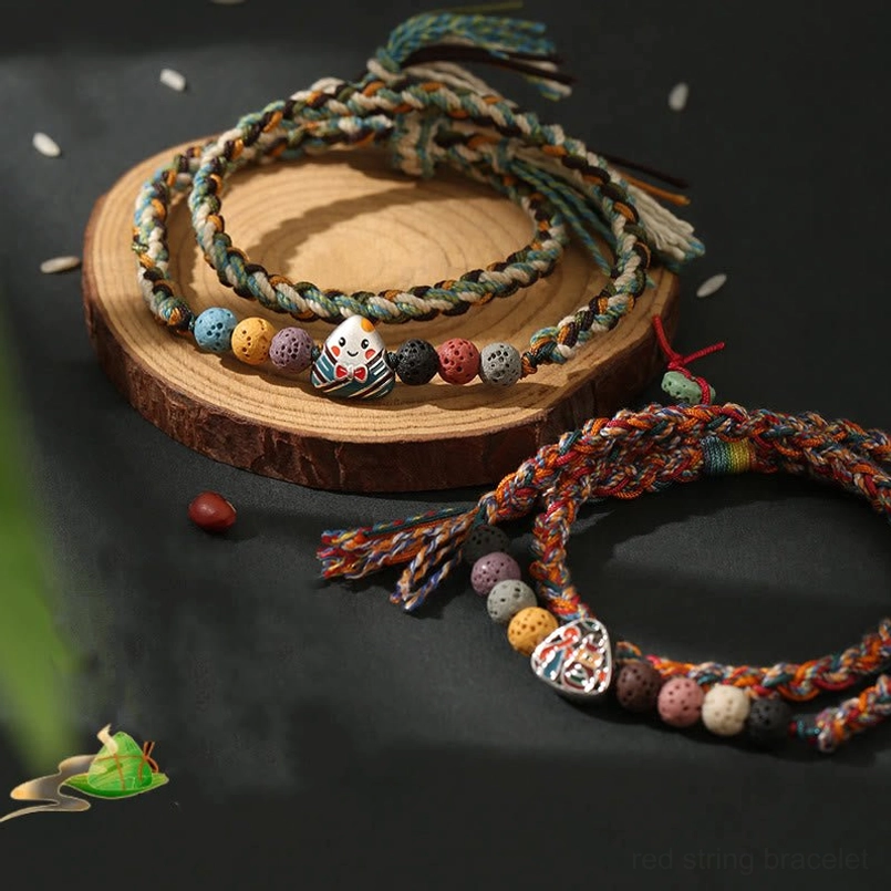 Colorful braided string bracelet tassel end detail shot