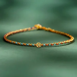 Colorful lucky coin bracelet with multicolor woven rope and gold ancient coin pendant, thin braided design