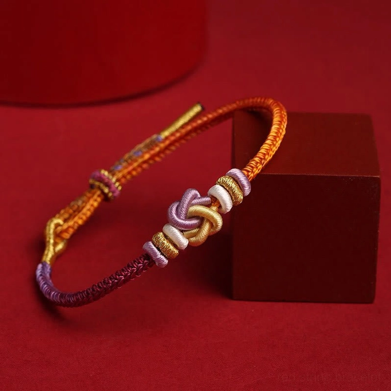 Braided colorful string bracelet with adjustable sliding knot closeup detail