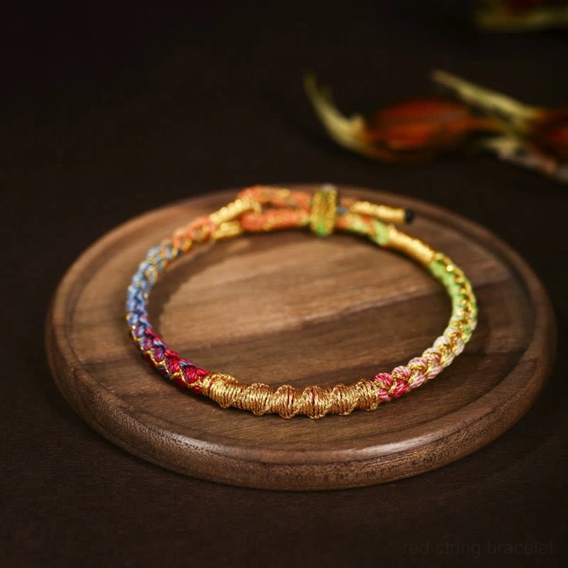 Colorful Tibetan dragon scale braided bracelet with multi-color gradient and gold woven thread