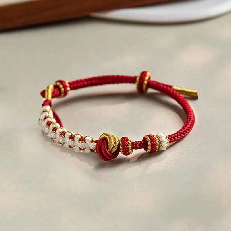 Common knot style red string bracelet with white-gold beads for protection and good fortune
