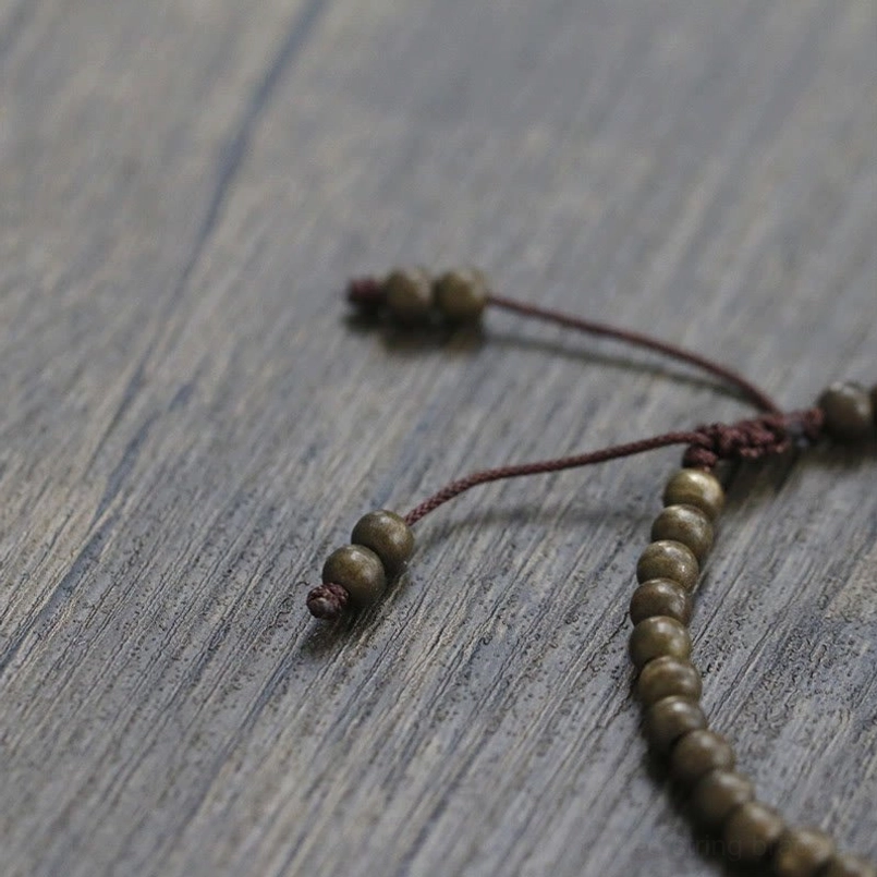 Copper brass bead red string bracelet lifestyle casual wear scene