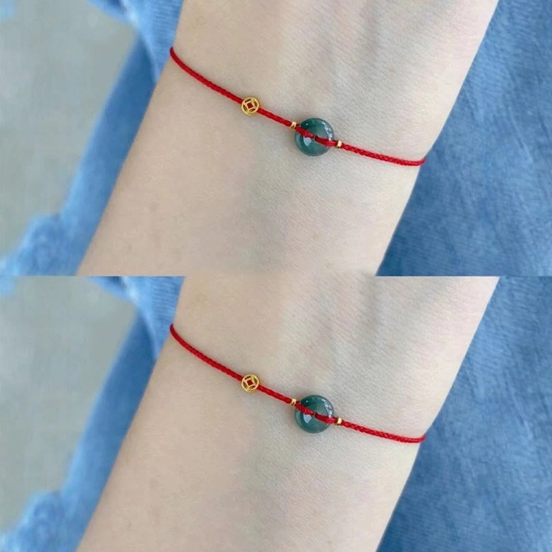 Jade peace buckle red string bracelet detail showing gold plated copper coin and green jade donut charm
