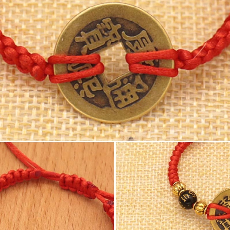 Close-up of copper coin red string bracelet showing Chinese characters and braided knot detail