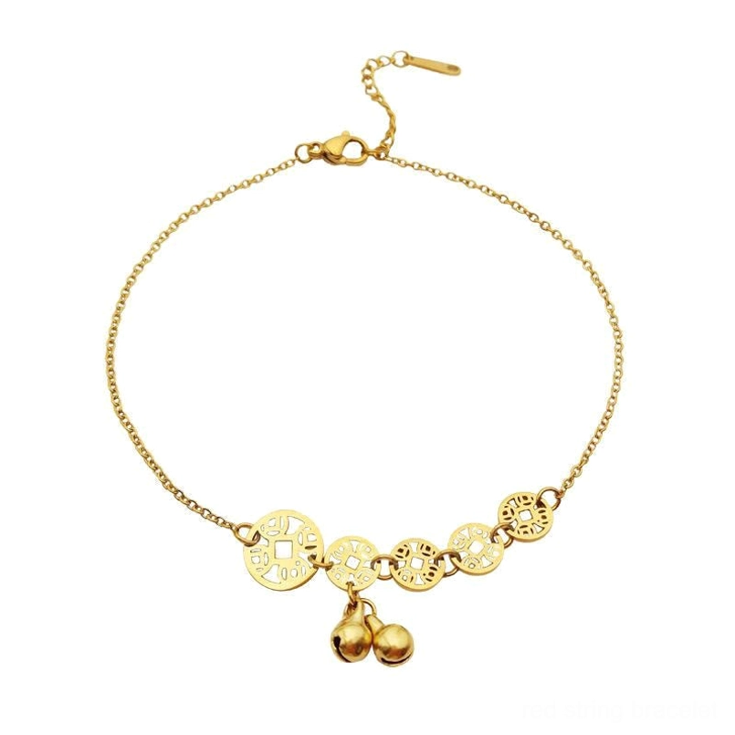 Flat lay of copper coins bell anklet with mixed size hollow coins and twin bells