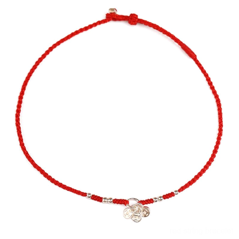 Ancient coins red string bracelet front view flat lay with silver beads and copper coin pendant