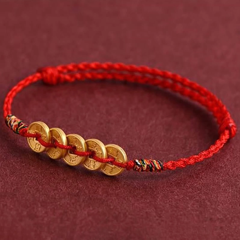 Five coin braided bracelet anklet side view showing coins mounted on red rope