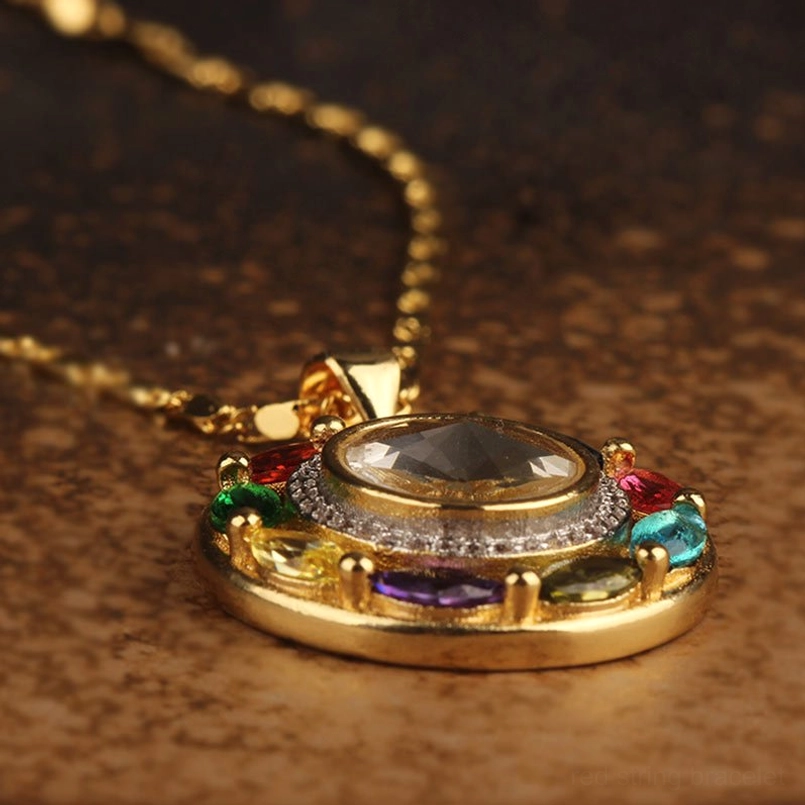 Copper pendant connector with chain and rotating zircon stone mechanism close-up