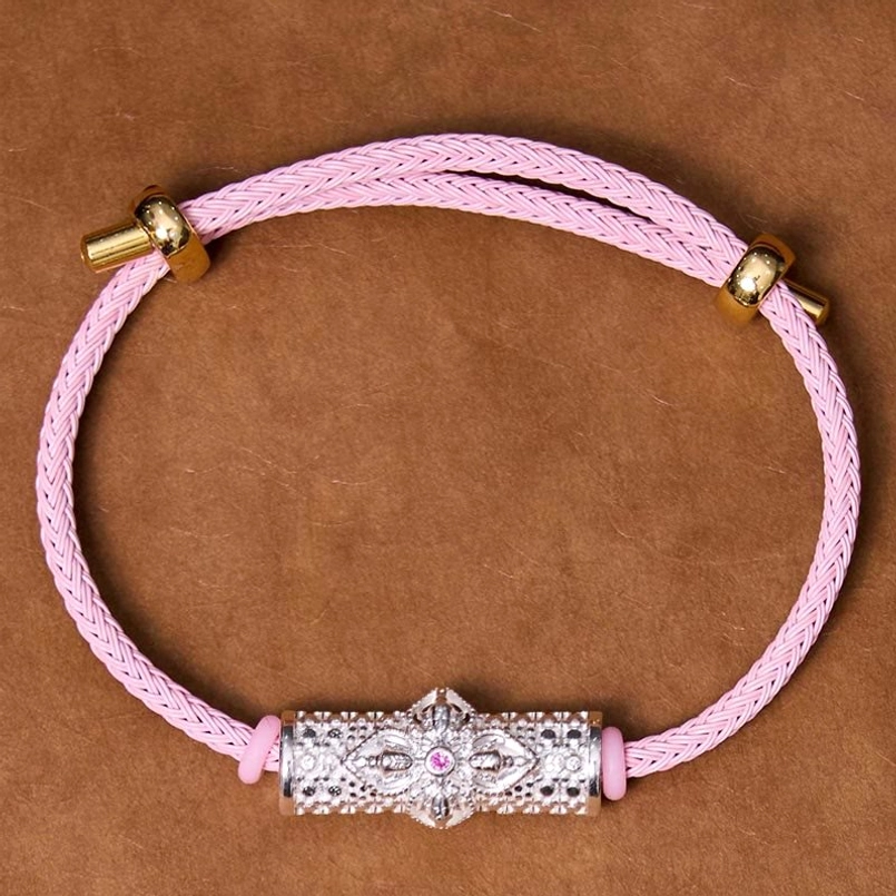 Copper luck bracelet with pink braided string and handcrafted enamel flower