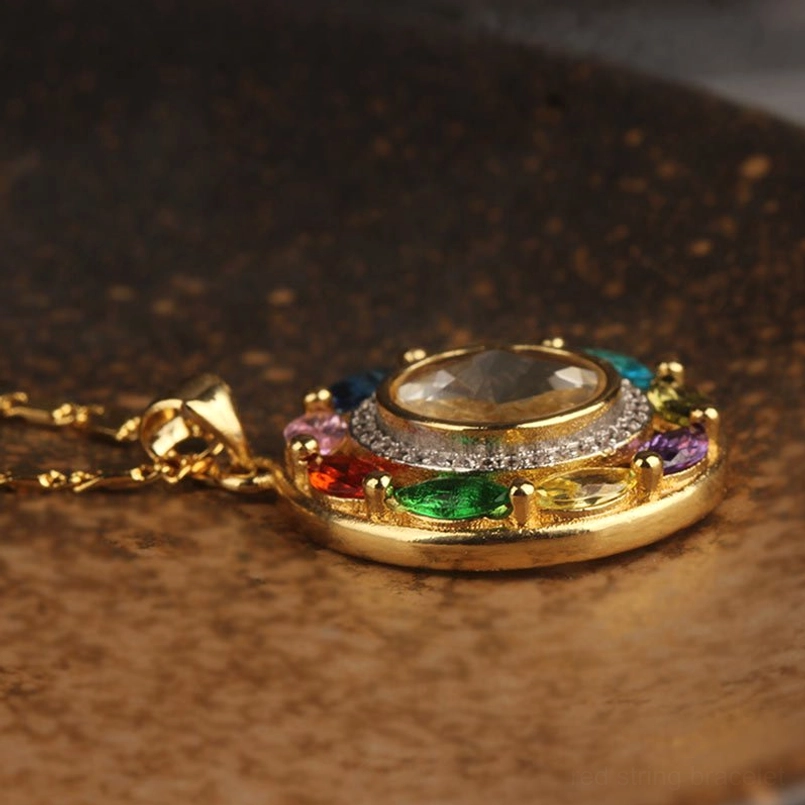 Gold chain copper pendant necklace with full rotating zircon stone oblique view