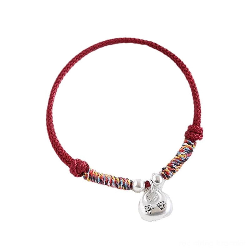 Couple matching red and black Fu protection bracelets flat lay display