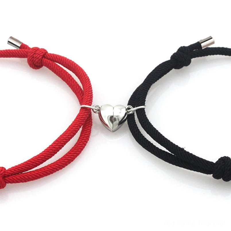 Handcrafted red string couple magnetic bracelets close-up detail shot
