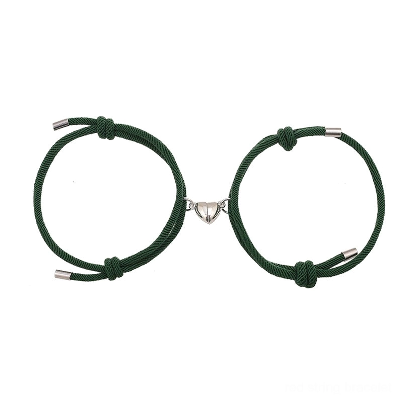 Red string couple magnetic bracelets close-up texture and material quality