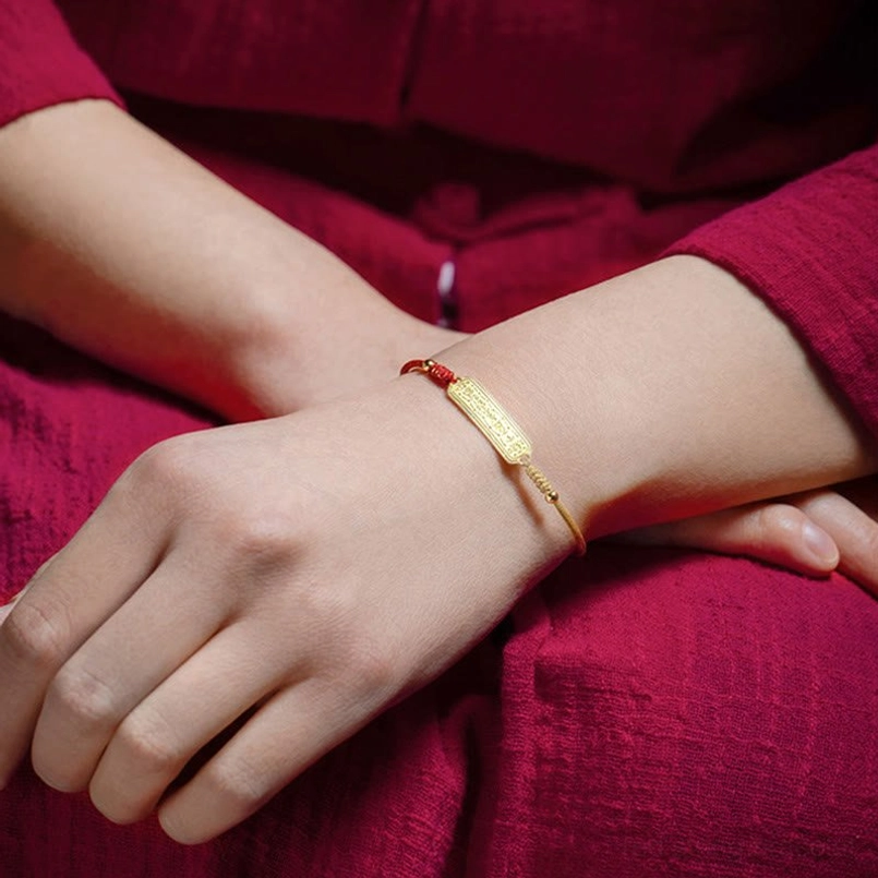 Two red gold amulet bracelets worn on both wrists double shot