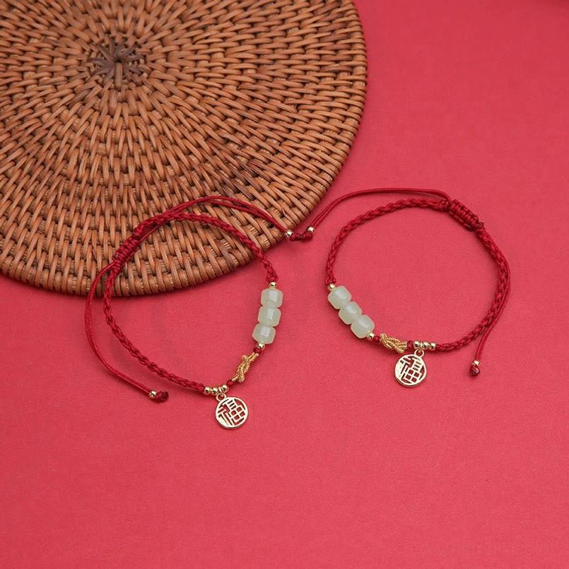 Pair of matching jade fu character red string bracelets for couples prosperity blessing