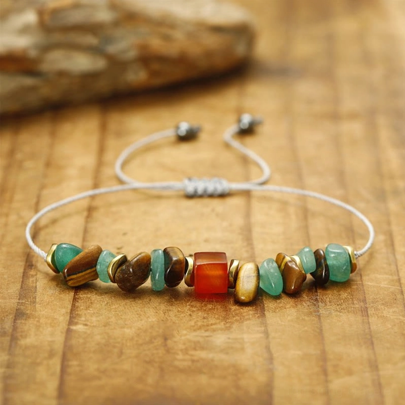 Close-up view of green aventurine tiger eye carnelian beads with grey adjustable cord