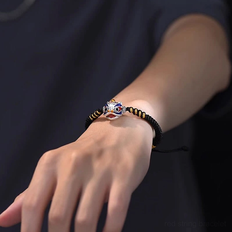 Black dancing lion fortune bracelet with adjustable drawstring closure and lion charm
