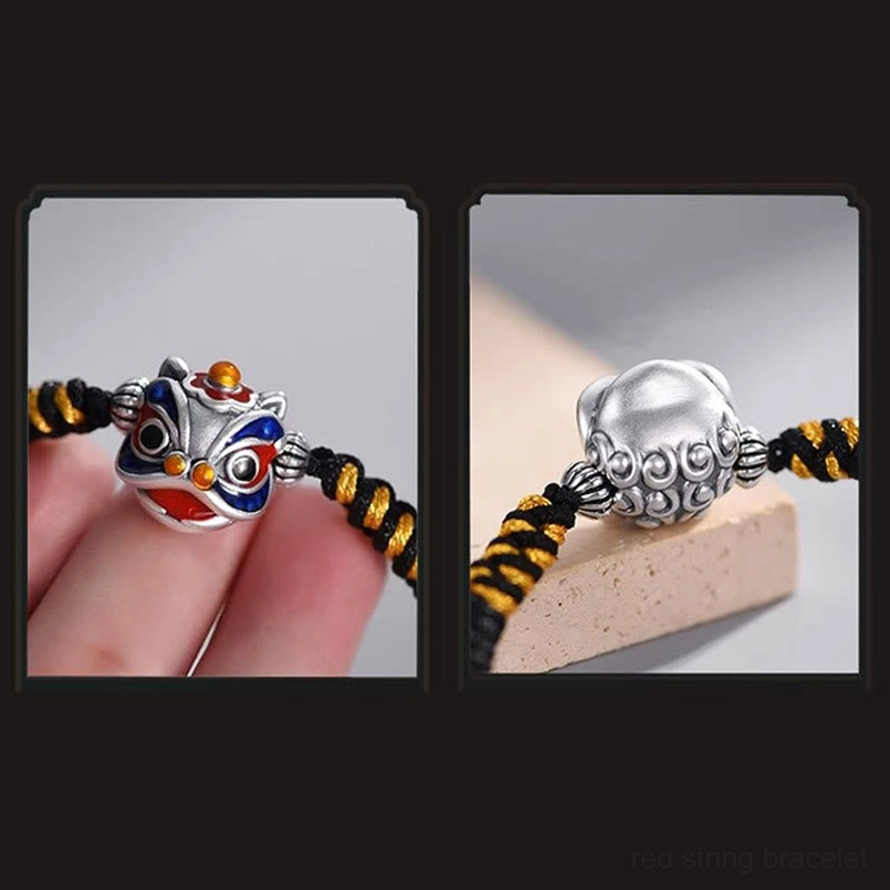 Dancing lion bracelet worn on finger and separate silver lion pendant enamel charm view