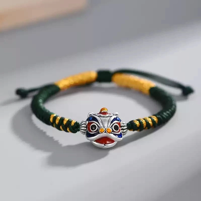 Green dancing lion harmony bracelet with hand-woven cord and silver enamel lion pendant
