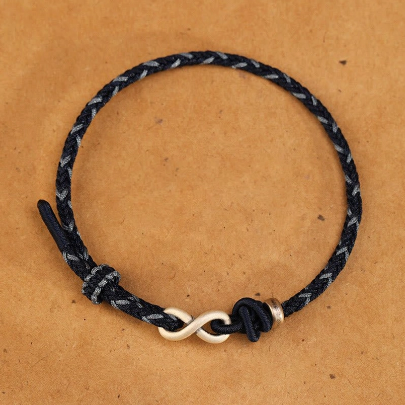 Dark blue braided rope endless knot bracelet with sterling silver infinity charm clasp