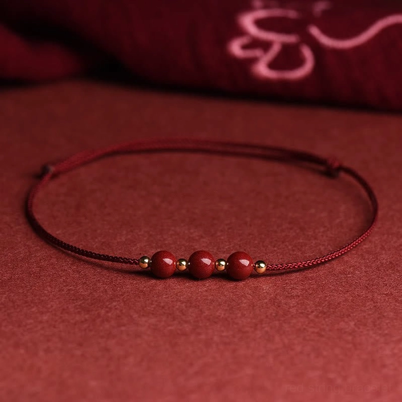 Dark red cinnabar bead anklet showing extended circumference for ankle wear