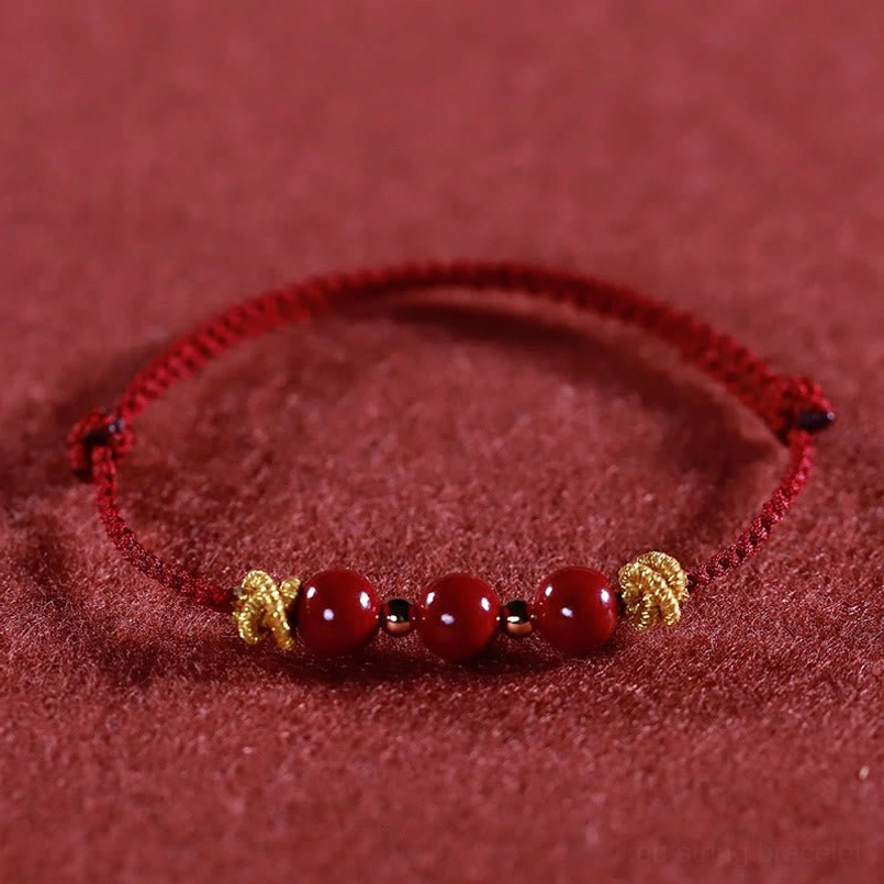 Dark red cinnabar bracelet close up detail shot of cinnabar beads
