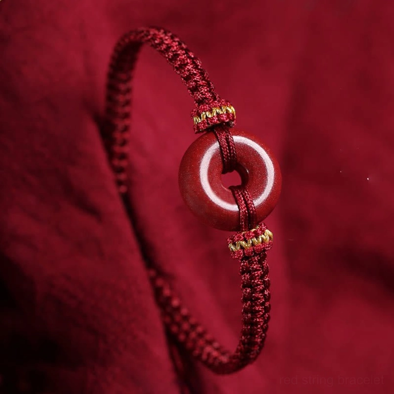 Dark red cinnabar peace buckle braided bracelet close-up side view