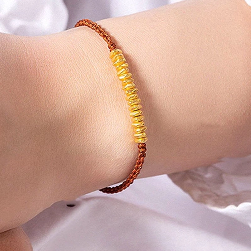 dark red 999 gold small pieces bracelet side view on model wrist