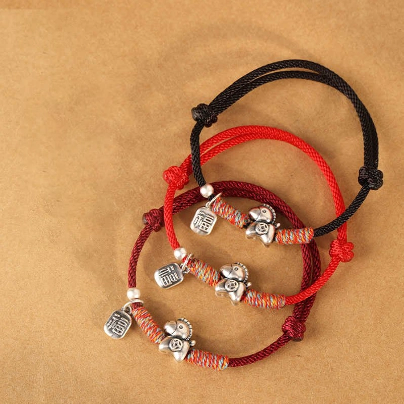 Dark red Year of the Horse fu character sterling silver luck bracelet with woven silver bead accent