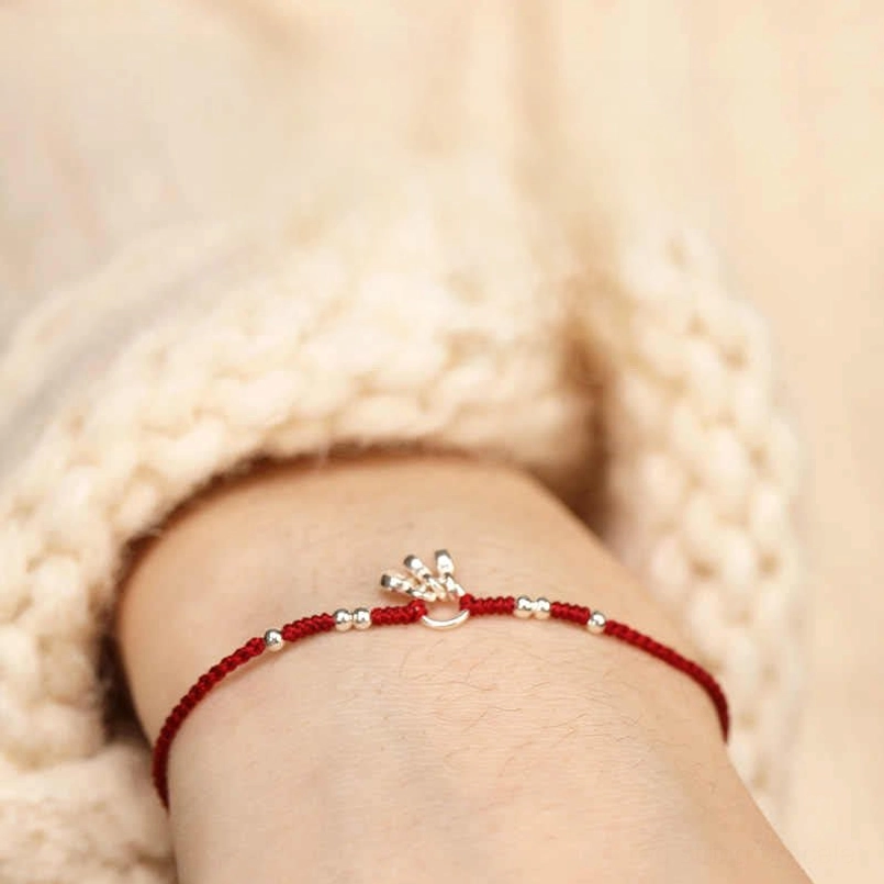 Dark red string bracelet close-up view showing 925 sterling silver coins and beads detail
