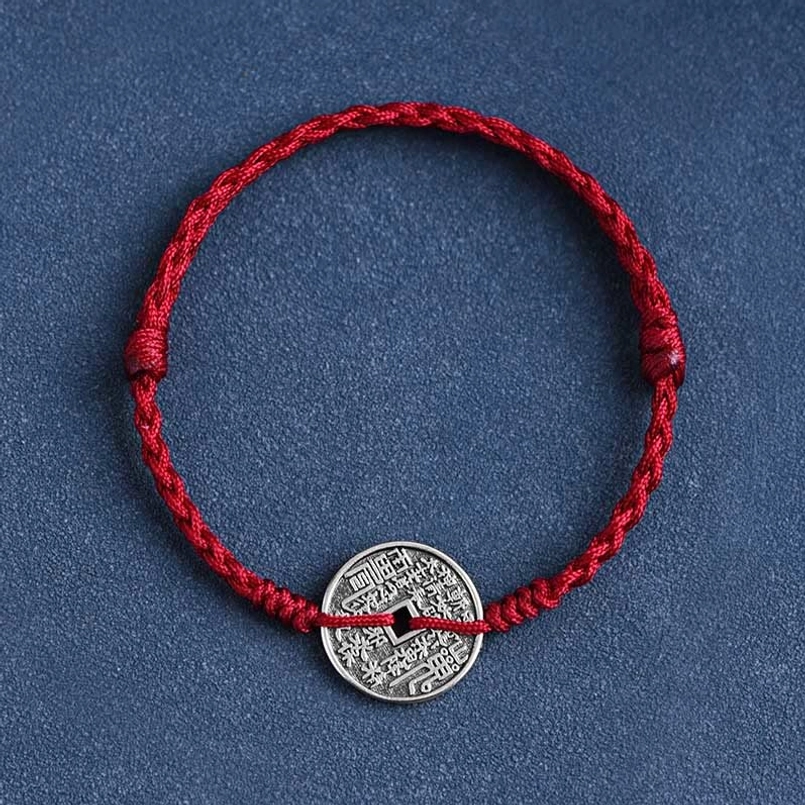 Dark red woven cord bracelet with 925 sterling silver coin top-down view