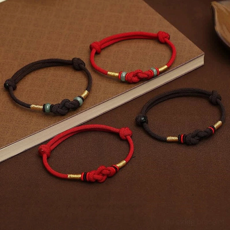 Dark red string jade couple bracelet with fate knot and protection symbolism