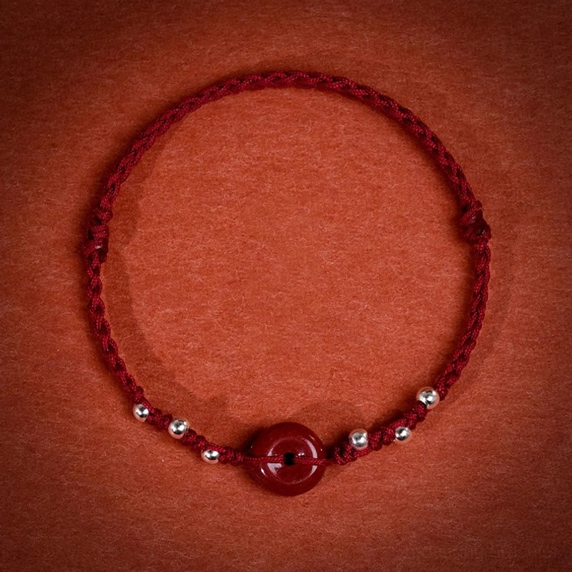 Dark red string cinnabar peace buckle bracelet braided cord with silver spacer beads