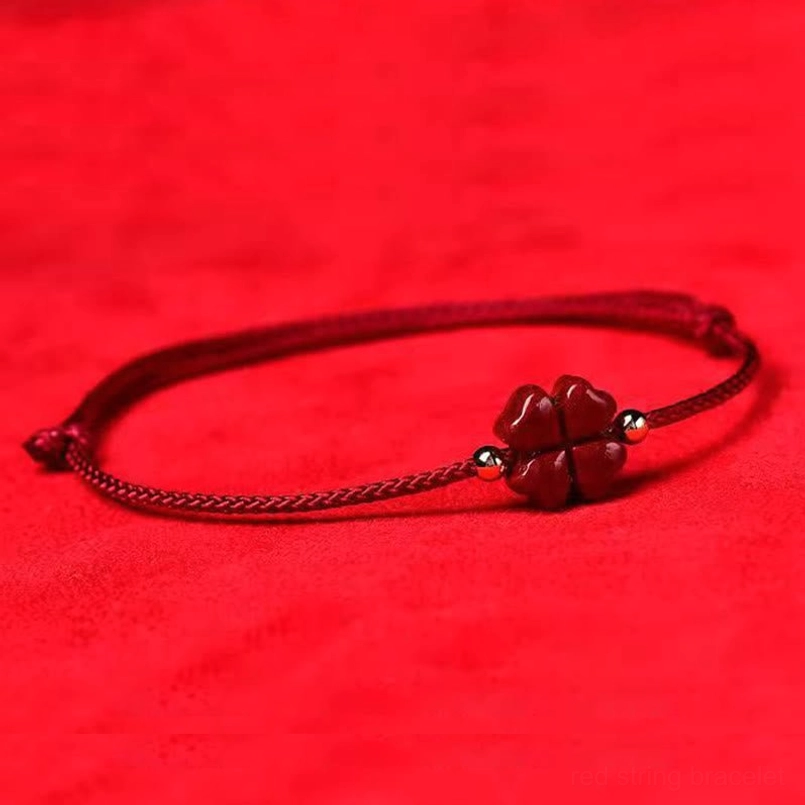 Deep red cinnabar four leaf clover string bracelet with metal accent beads side view