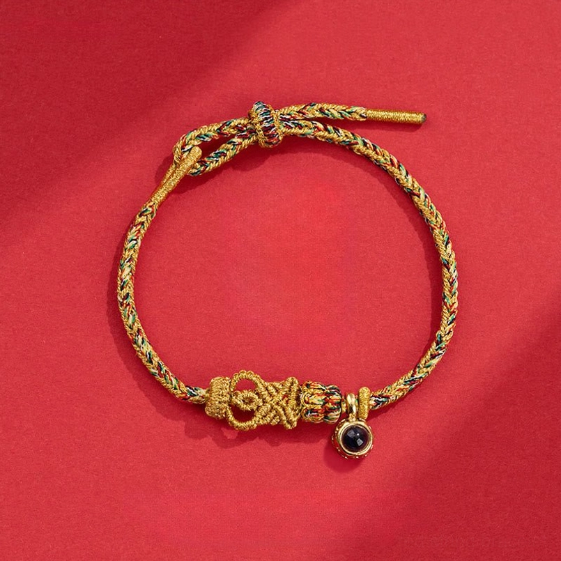 Deep yellow golden brown braided Buddha knot red string bracelet