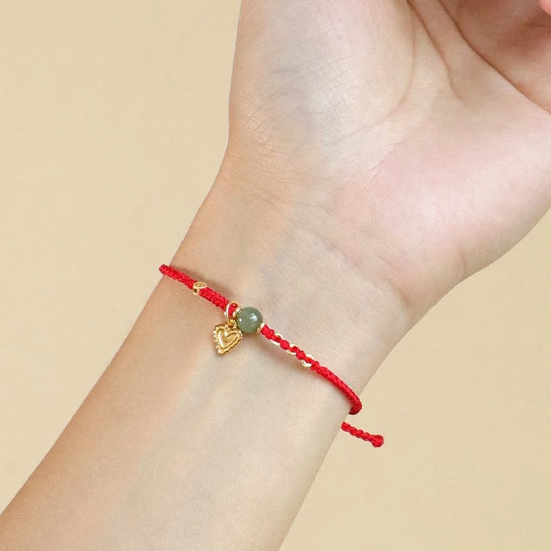 Hetian jade red string bracelet on wrist daily wear closeup