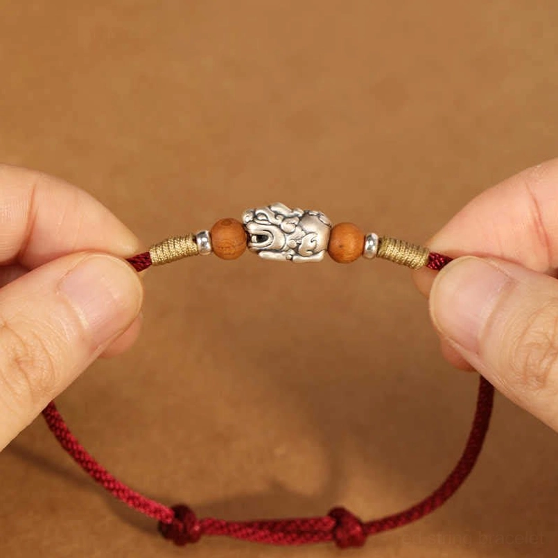 Double Pixiu Sterling Silver Red String Bracelet - Hand-Held Close-Up