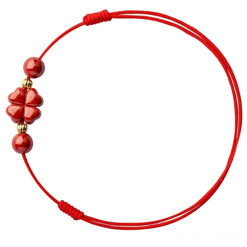 Double strand cinnabar red string anklet with adjustable braided knots and gold accents overhead
